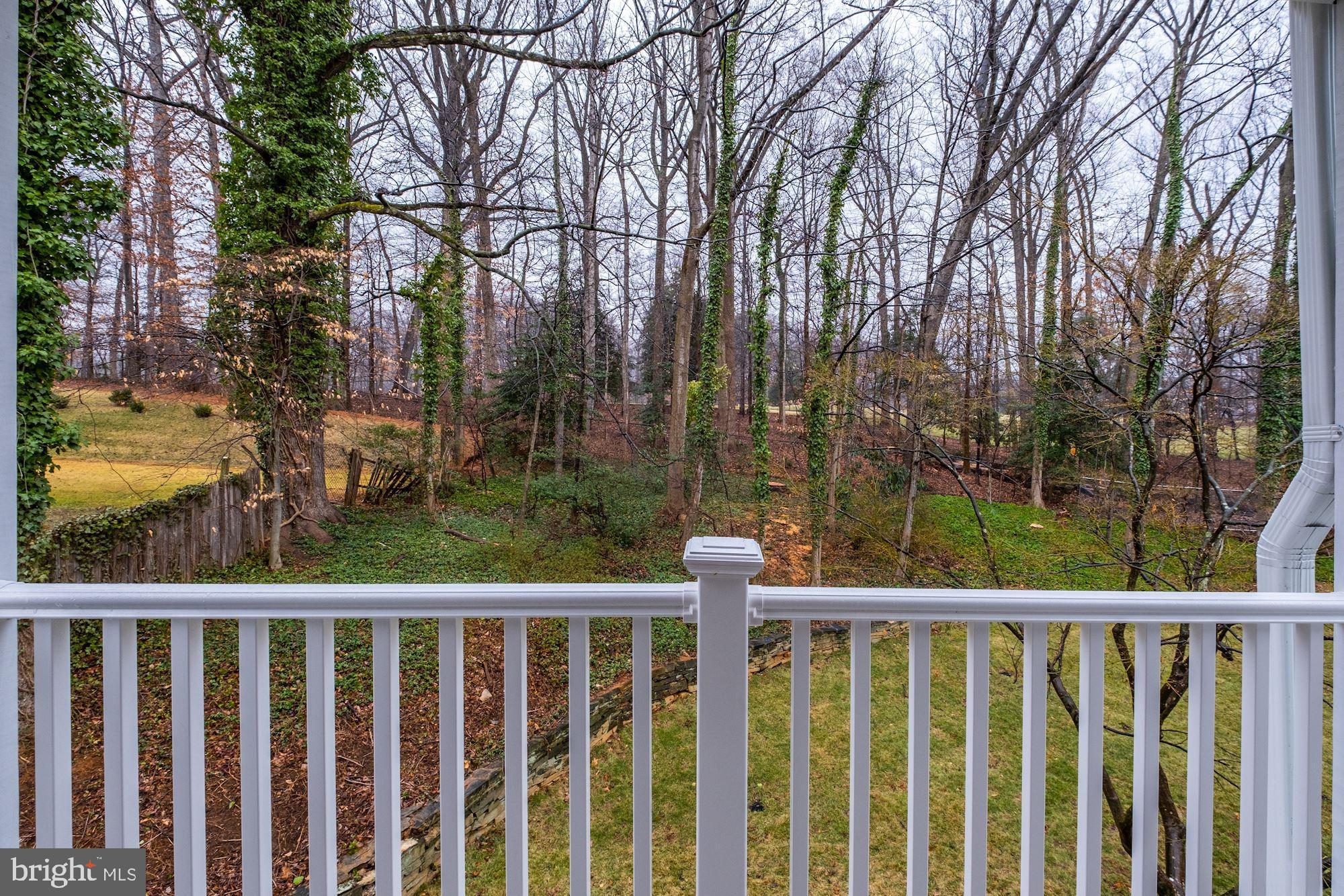 7440 Arrowood Road Bethesda, MD 20817 - Photo 49 of 79 a view of a balcony with wooden fence and floor