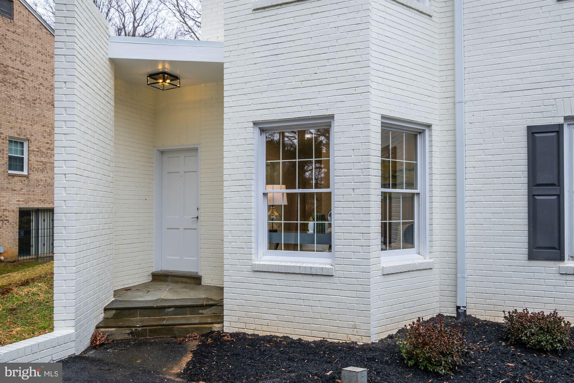 7440 Arrowood Road Bethesda, MD 20817 - Photo 5 of 79 a view of a house with a yard and potted plants