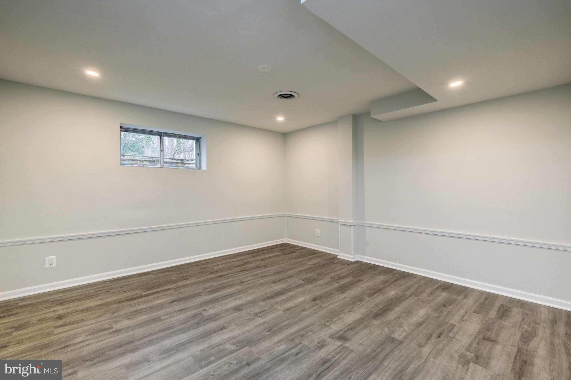 7440 Arrowood Road Bethesda, MD 20817 - Photo 68 of 79 a view of a room with wooden floor