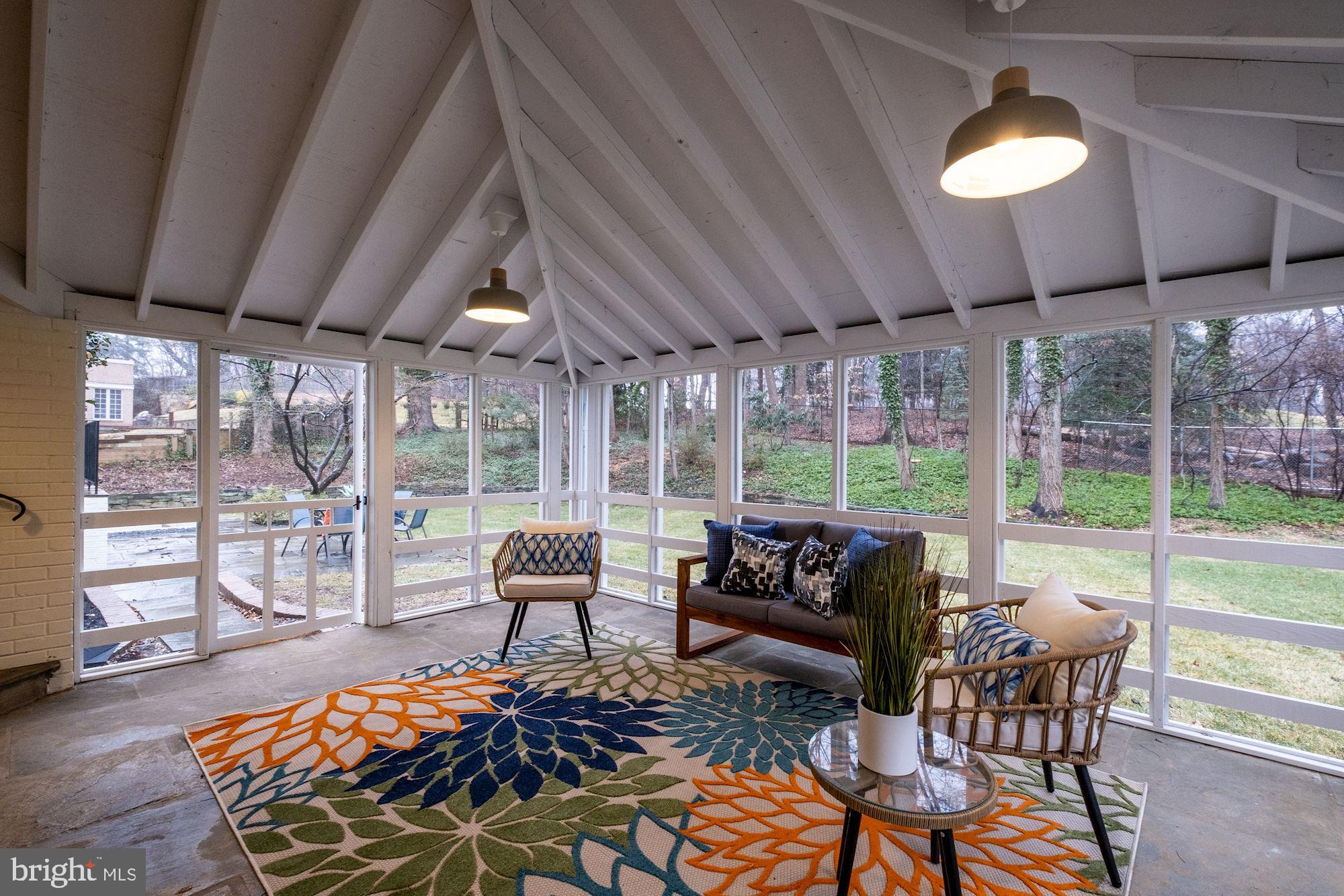 7440 Arrowood Road Bethesda, MD 20817 - Photo 70 of 79 a living room with furniture and a floor to ceiling window