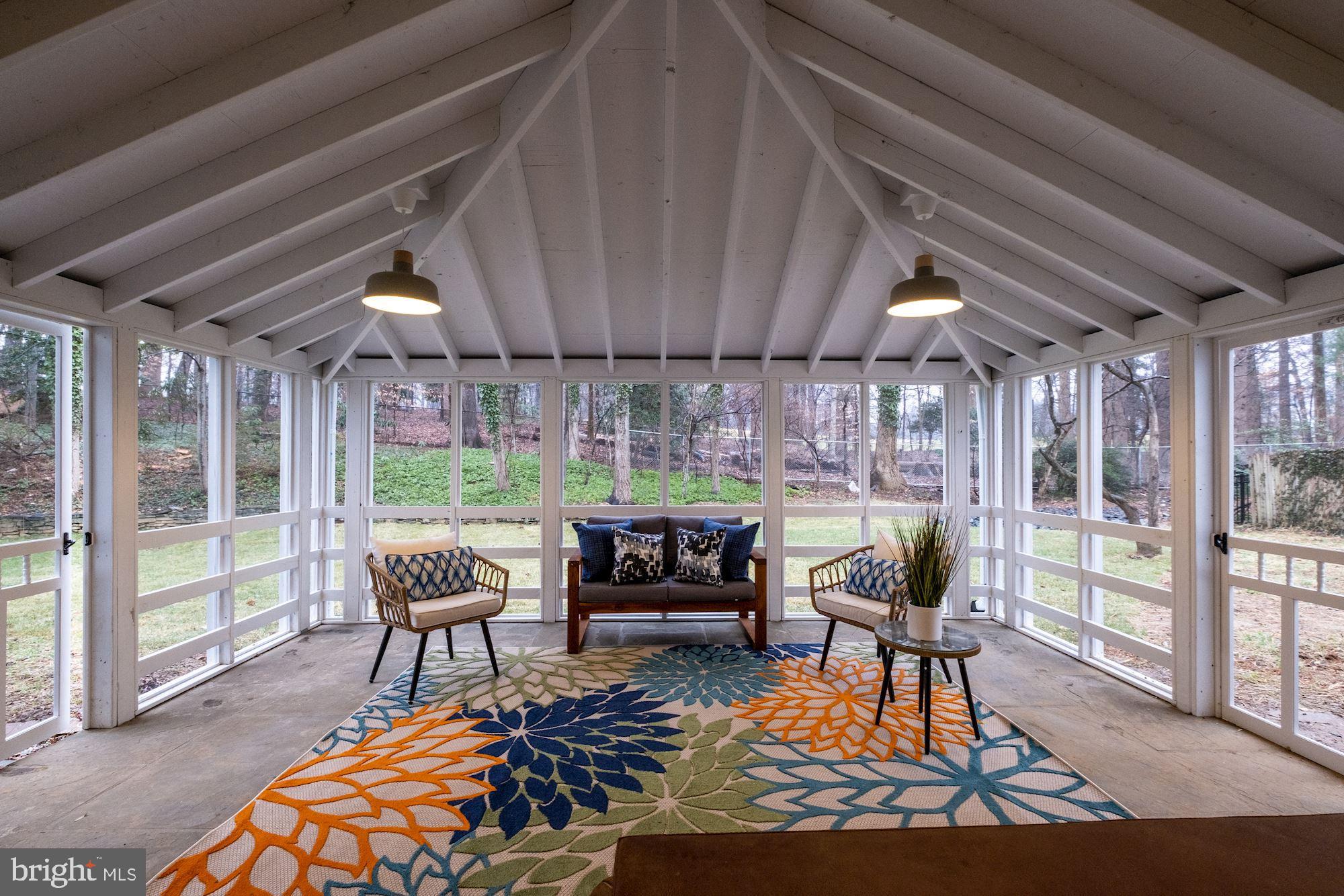 7440 Arrowood Road Bethesda, MD 20817 - Photo 7 of 79 a outdoor living space with patio furniture and a potted plant