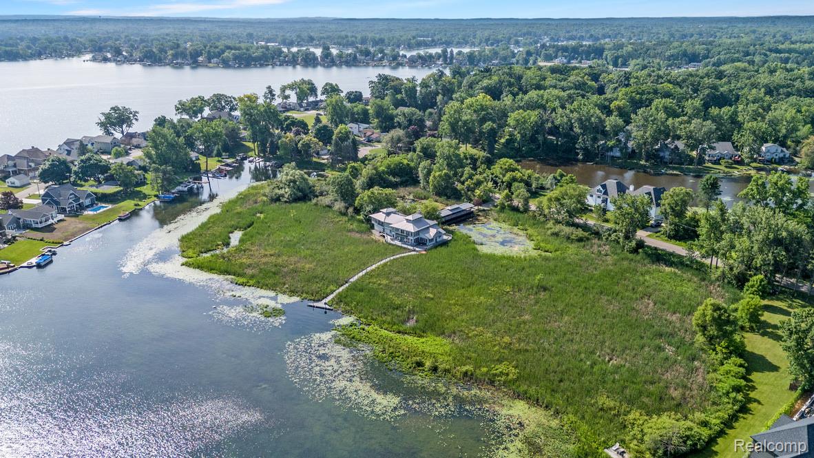 2350 Crane Road Fenton, MI 48430 - Photo 41 of 58 Aerial perspective of suburban area with a nearby body of water