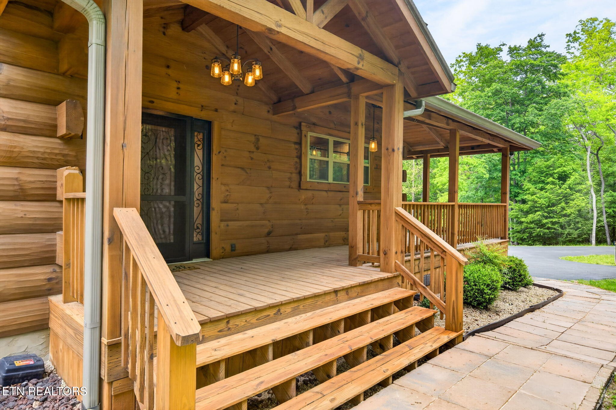 704 White Oak Road Monterey, TN 38574 - Photo 11 of 60 a view of a balcony with chairs and potted plants