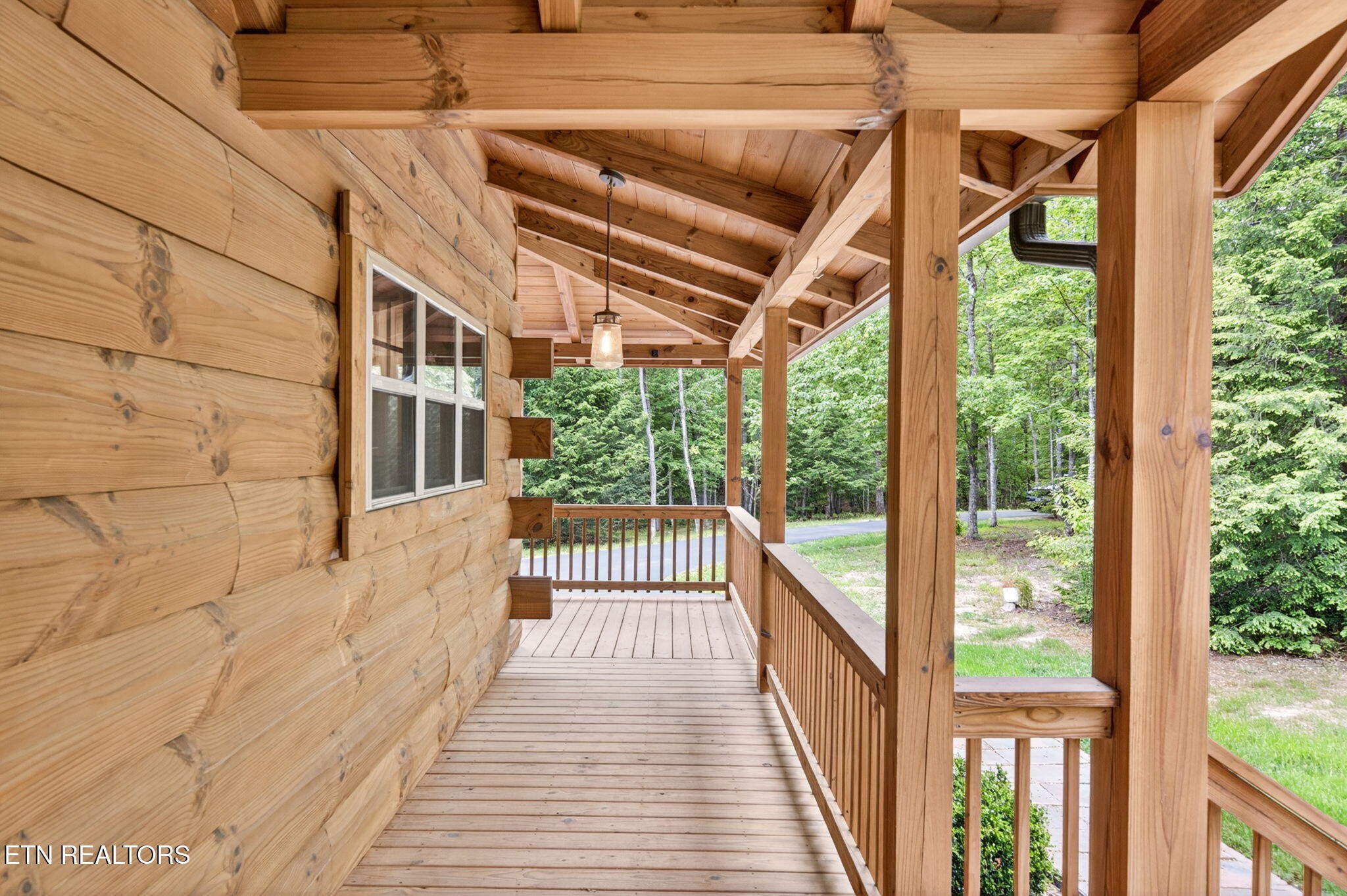 704 White Oak Road Monterey, TN 38574 - Photo 12 of 60 a view of a porch with wooden floor and stairs