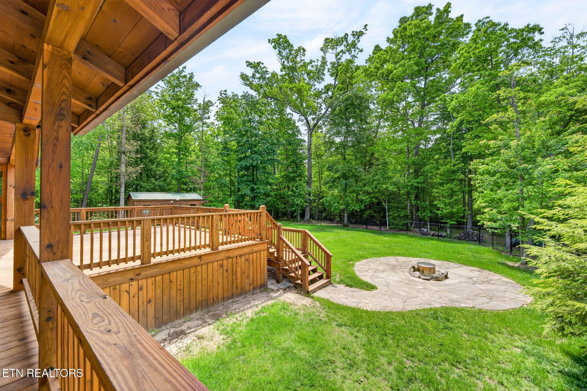 704 White Oak Road Monterey, TN 38574 - Photo 16 of 60 a view of a backyard with a small cabin