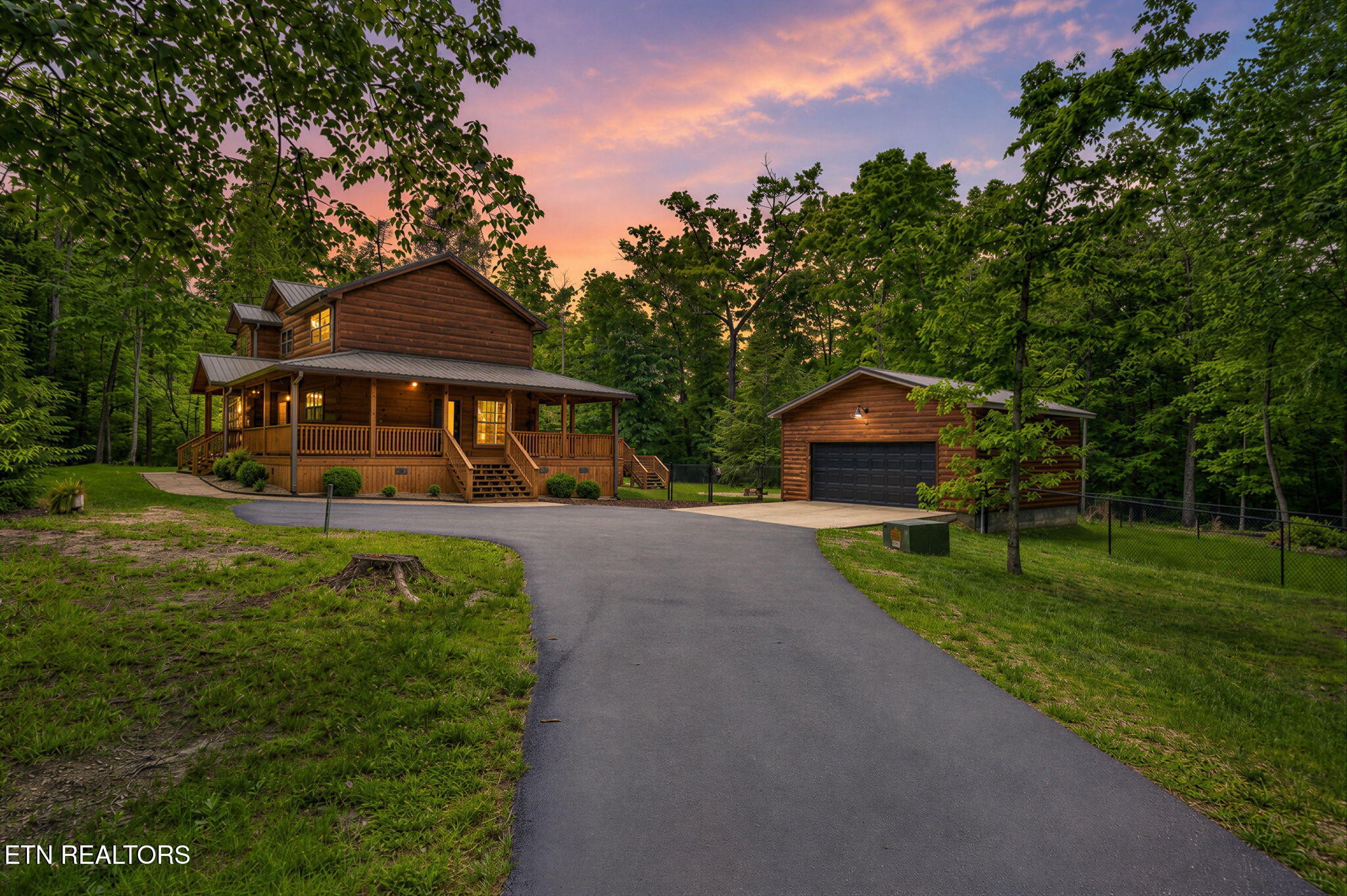704 White Oak Road Monterey, TN 38574 - Photo 2 of 60 a front view of a house with a yard
