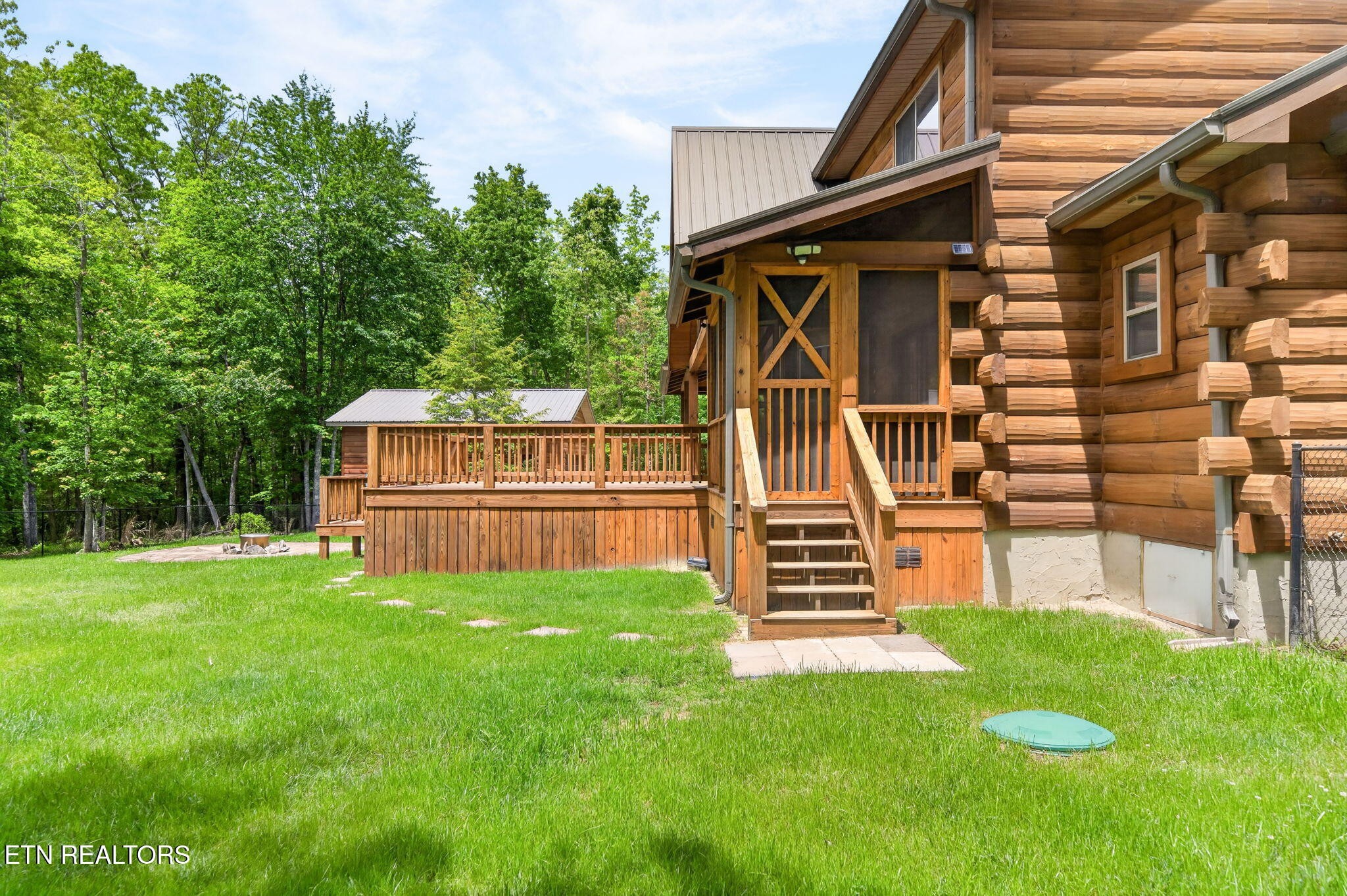 704 White Oak Road Monterey, TN 38574 - Photo 21 of 60 a view of a back yard of the house with a small garden