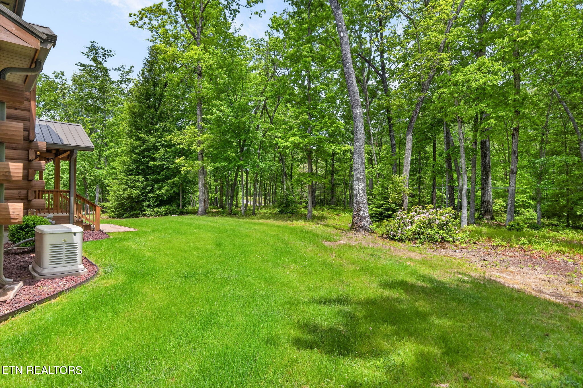 704 White Oak Road Monterey, TN 38574 - Photo 22 of 60 a view of a backyard with a garden