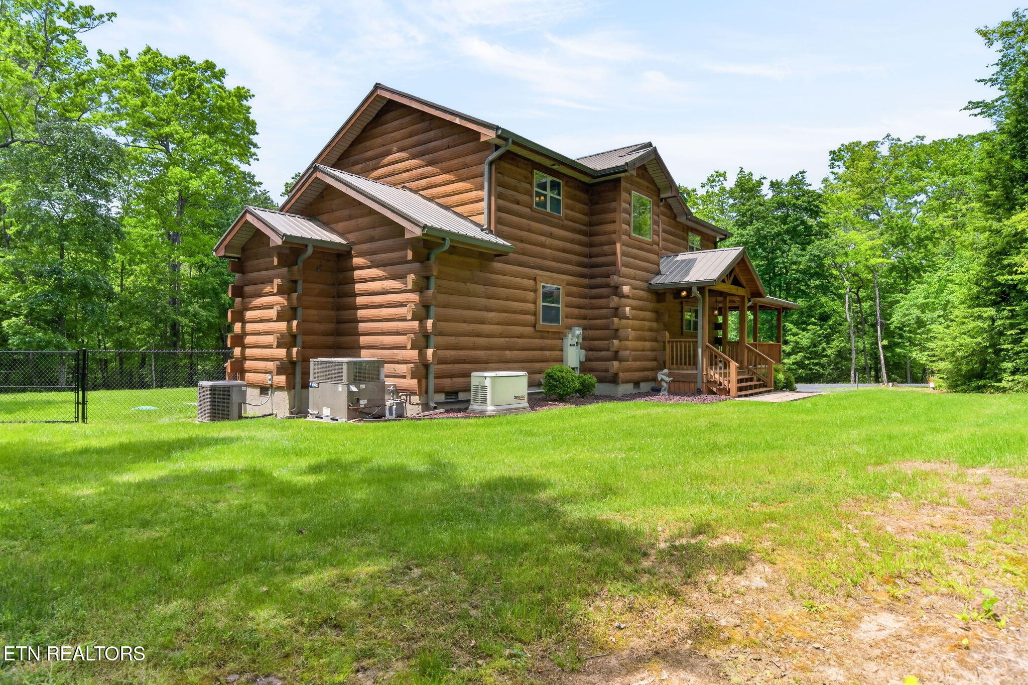 704 White Oak Road Monterey, TN 38574 - Photo 23 of 60 a front view of a house with a garden