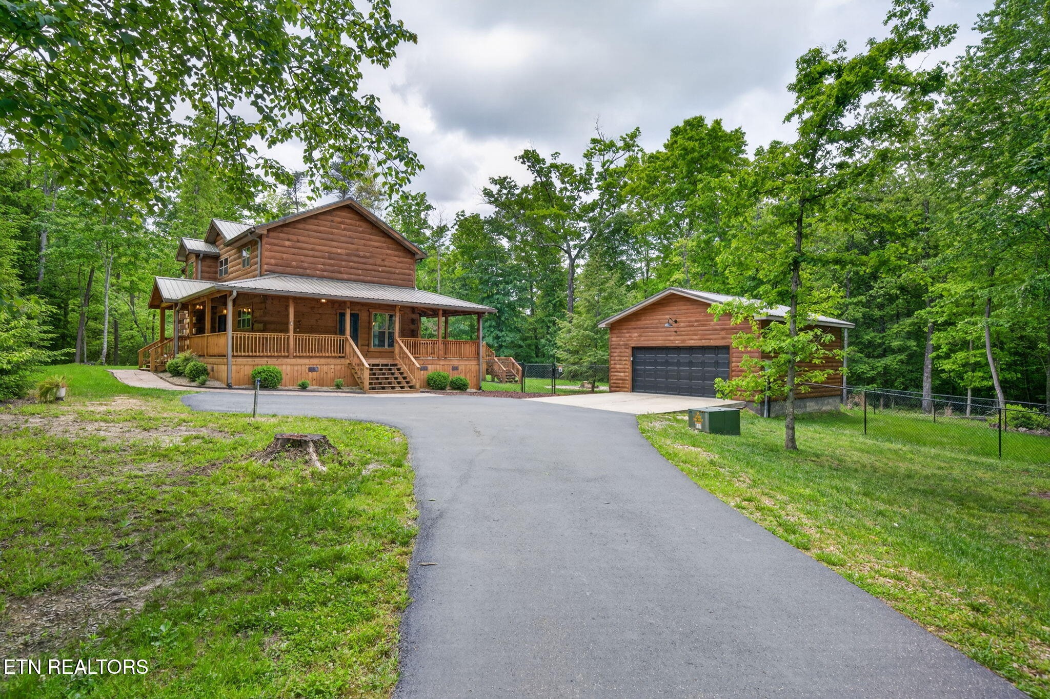 704 White Oak Road Monterey, TN 38574 - Photo 3 of 60 a front view of a house with a yard