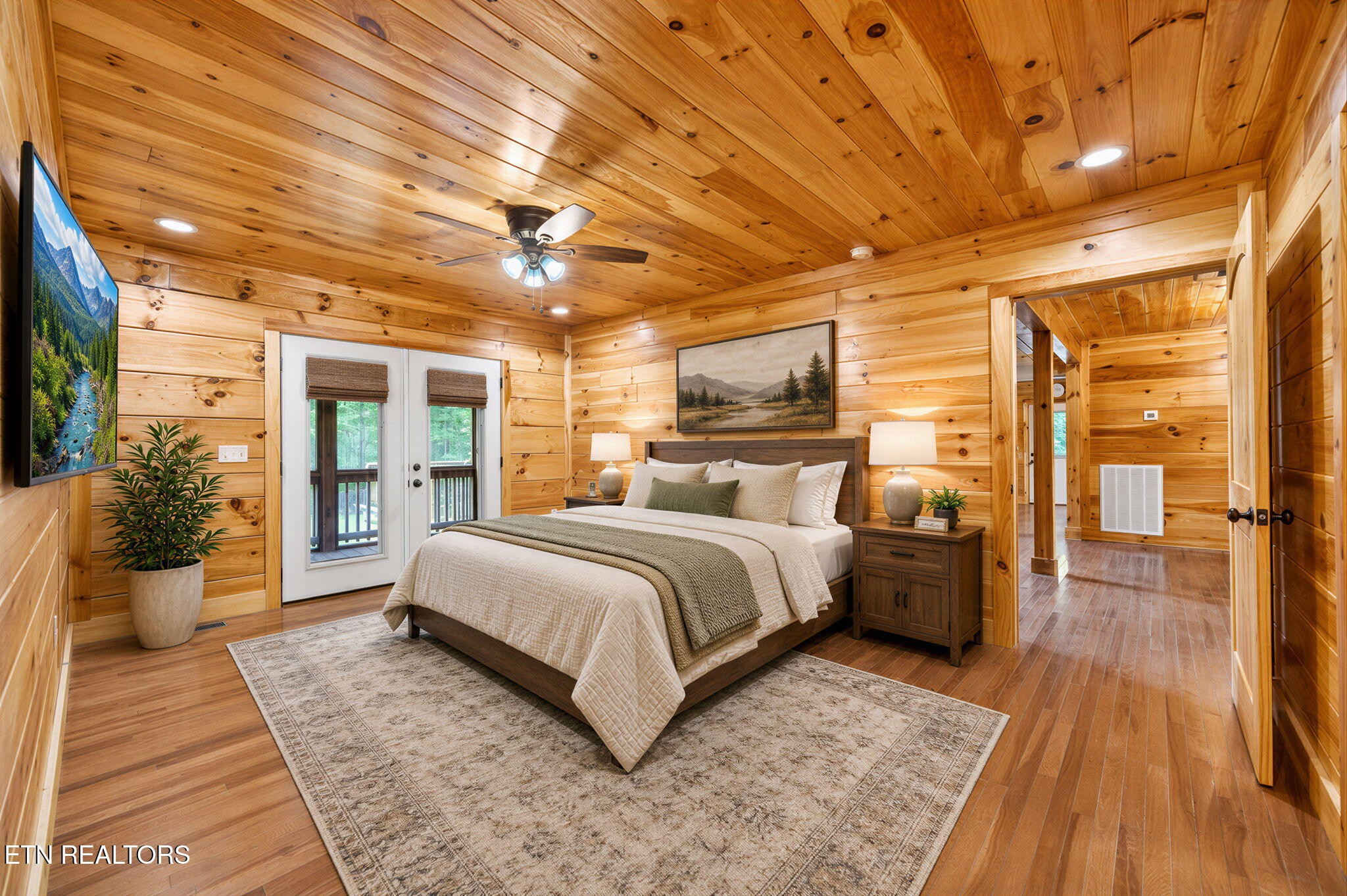 704 White Oak Road Monterey, TN 38574 - Photo 32 of 60 a bed room with a bed and wooden floor