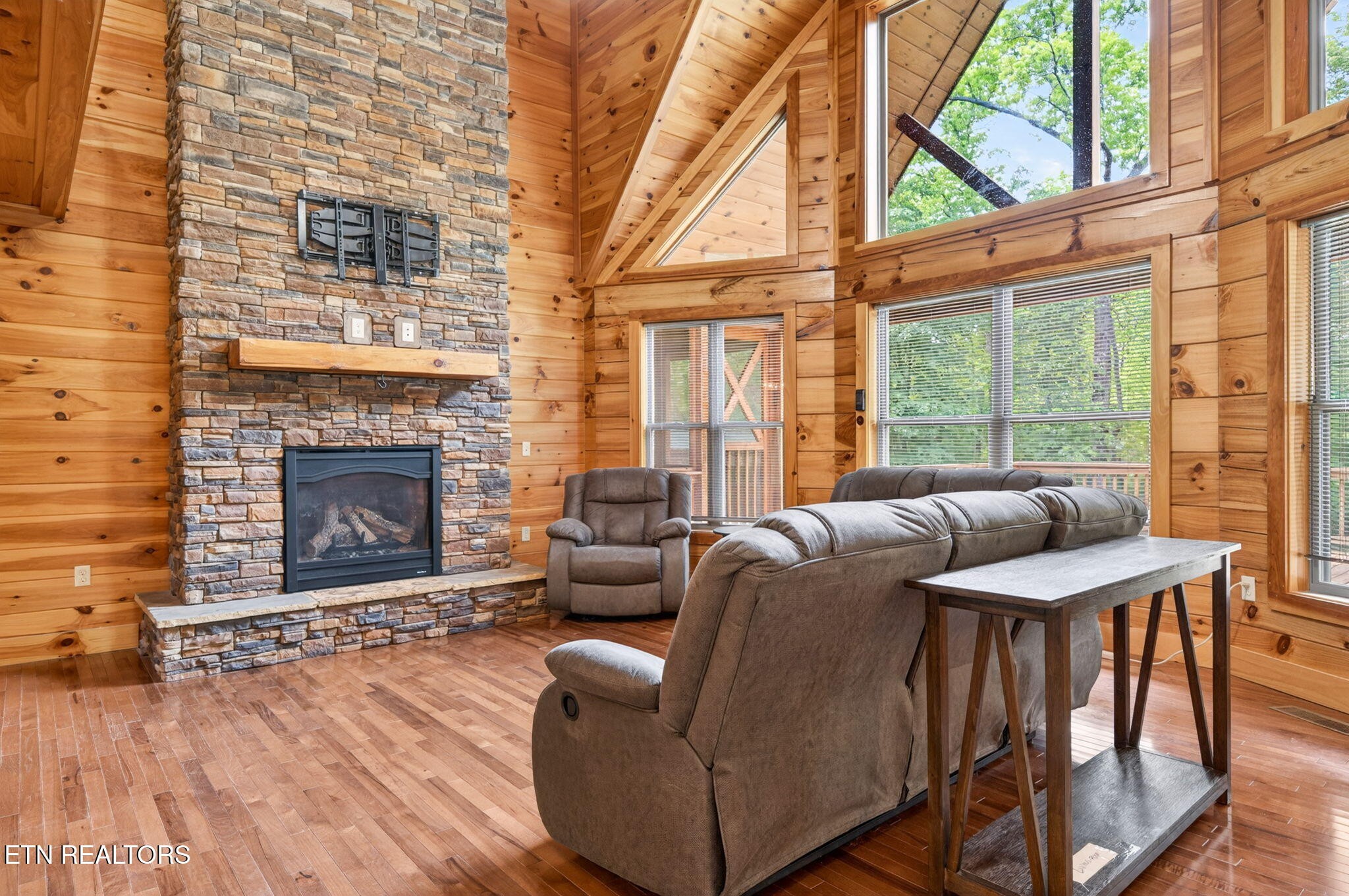 704 White Oak Road Monterey, TN 38574 - Photo 36 of 60 a living room with furniture a fireplace and a large window