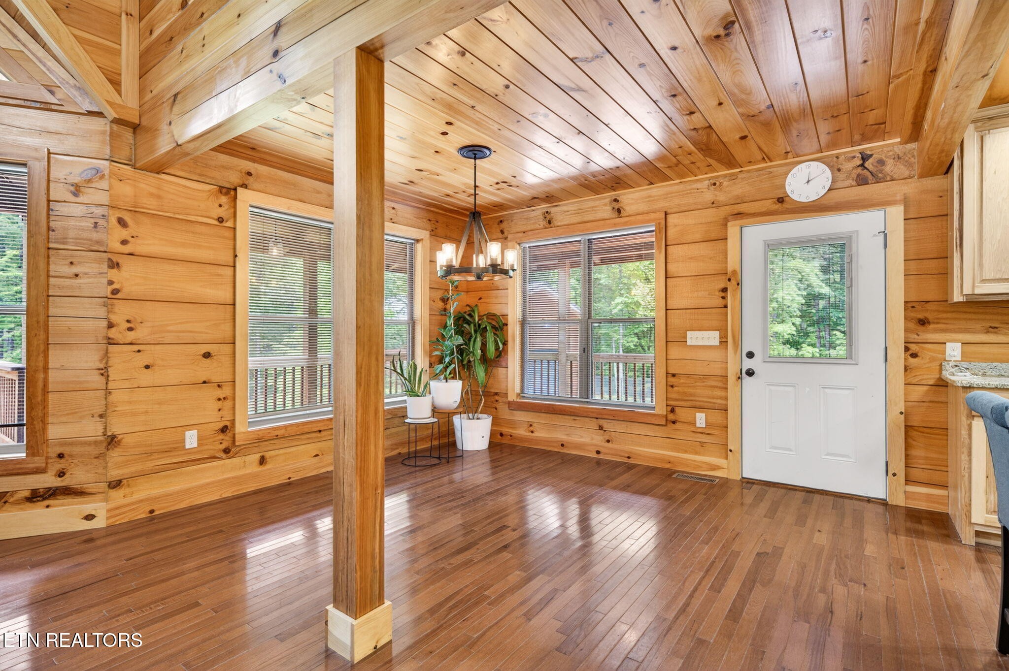 704 White Oak Road Monterey, TN 38574 - Photo 38 of 60 a view of a room with wooden floor and floor to ceiling windows