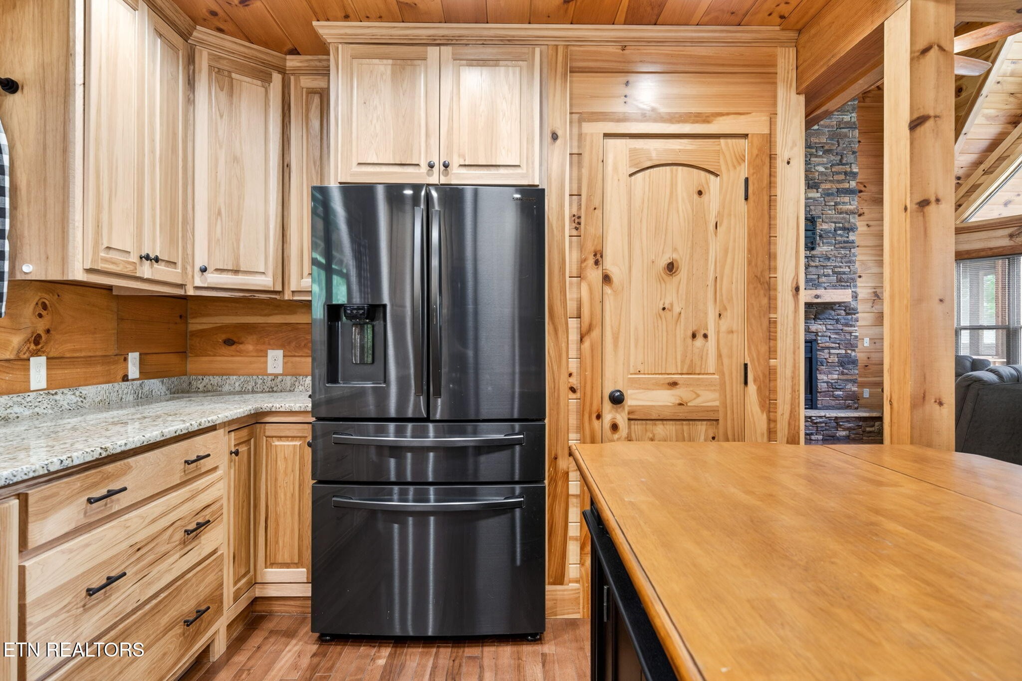 704 White Oak Road Monterey, TN 38574 - Photo 43 of 60 a kitchen with stainless steel appliances granite countertop a refrigerator and a sink