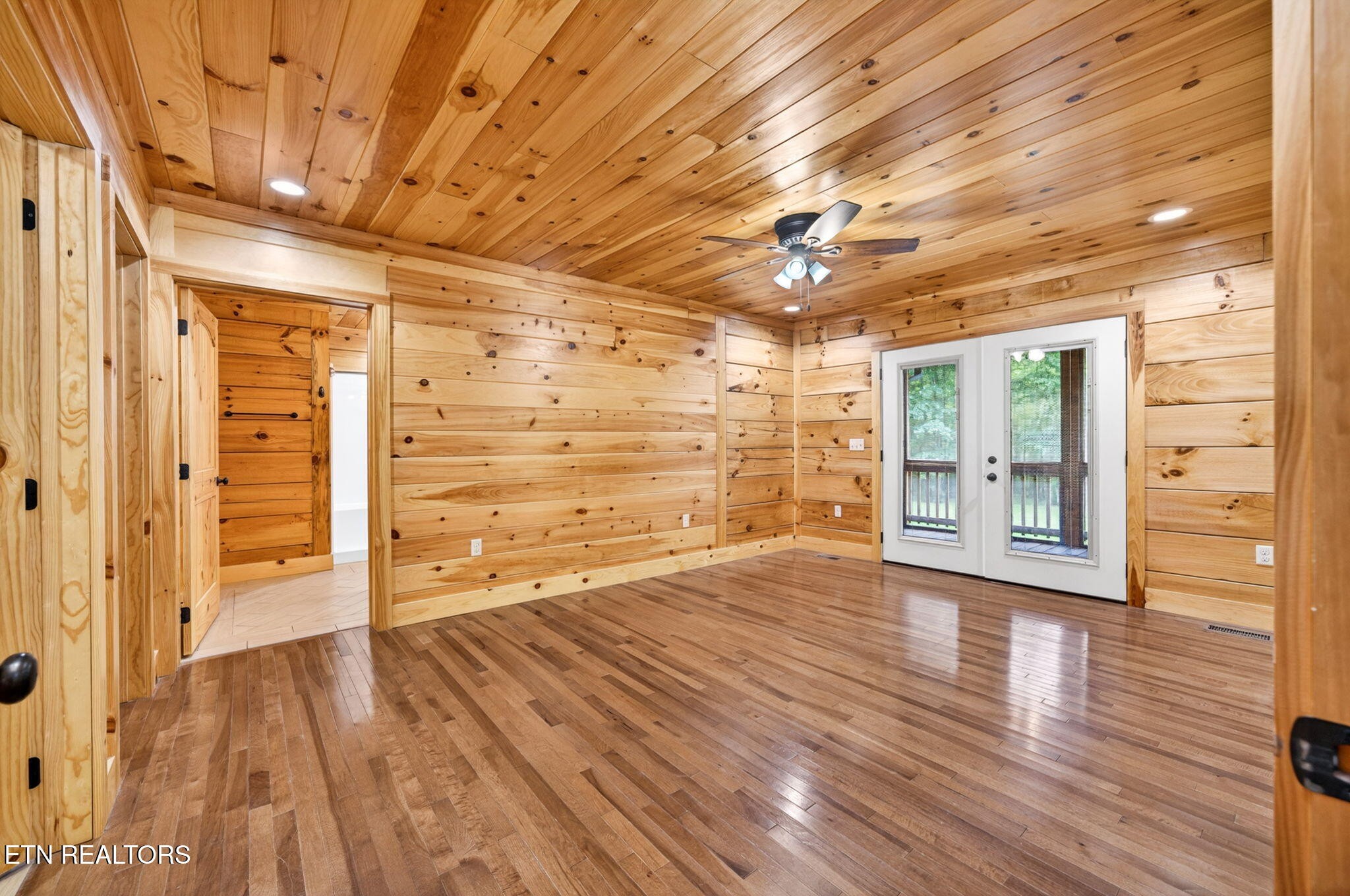 704 White Oak Road Monterey, TN 38574 - Photo 46 of 60 a view of an empty room with wooden floor and a window