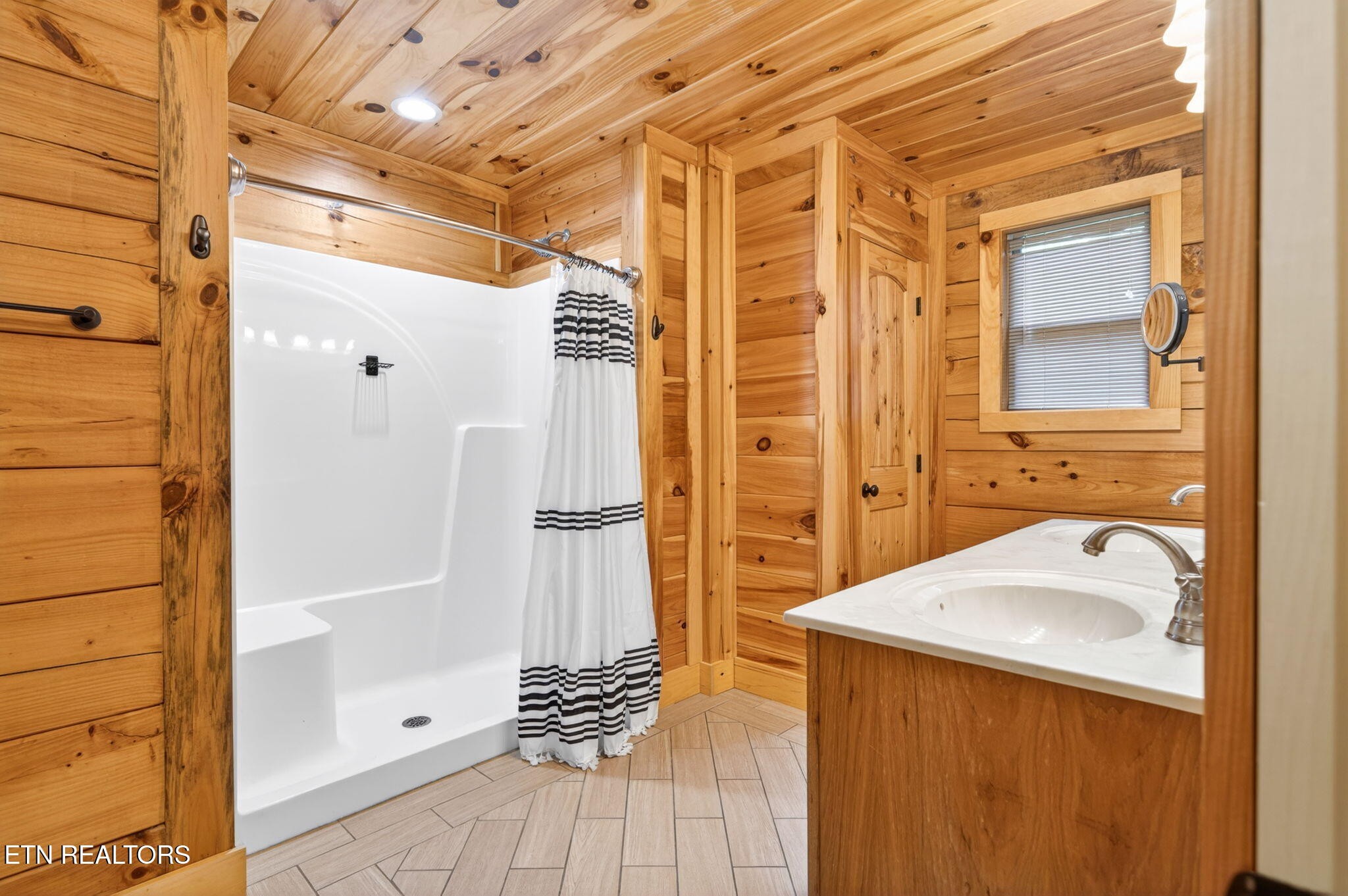 704 White Oak Road Monterey, TN 38574 - Photo 53 of 60 a bathroom with a sink and a shower
