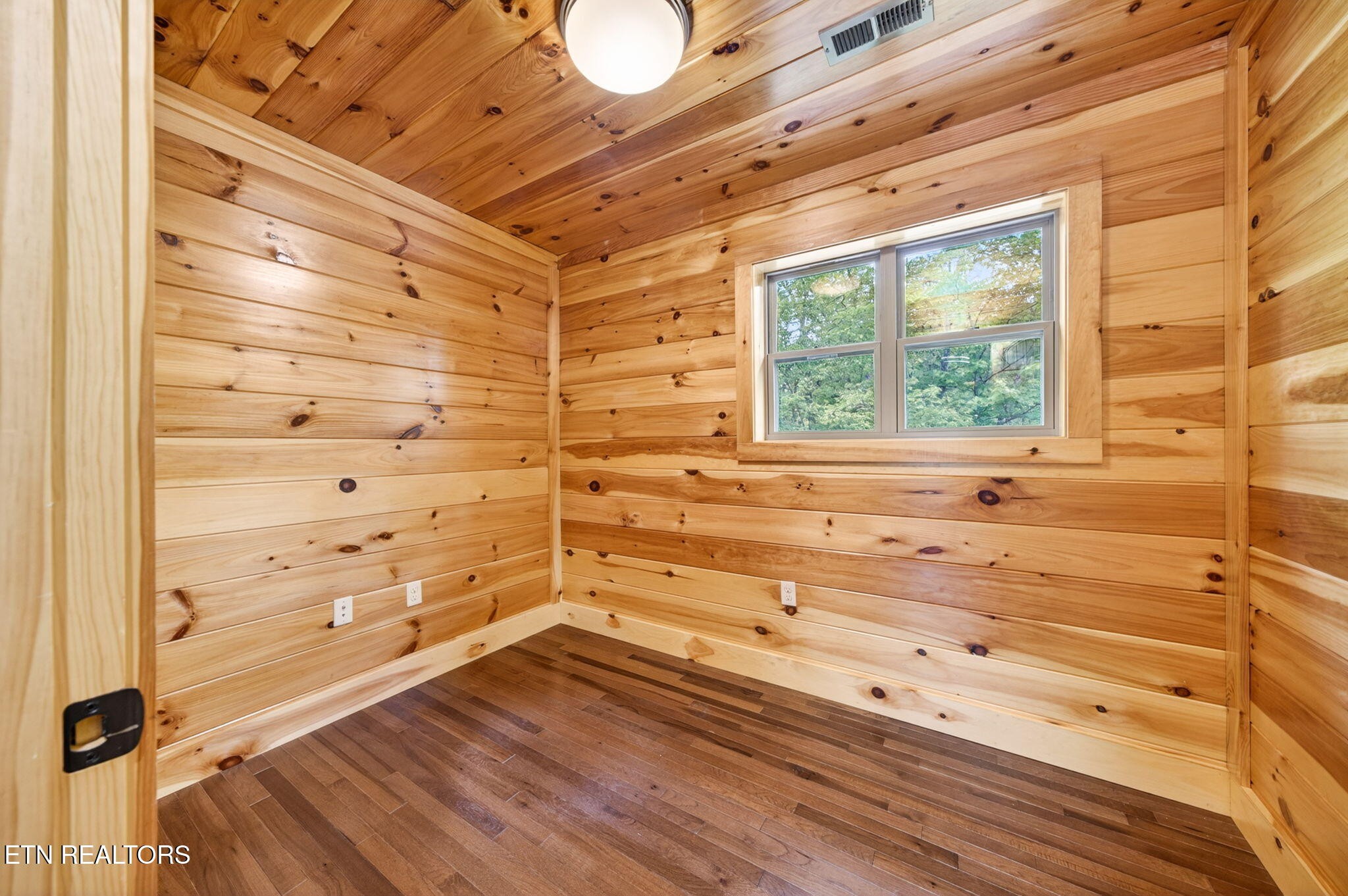 704 White Oak Road Monterey, TN 38574 - Photo 57 of 60 a view of a bathroom with a bathtub and window