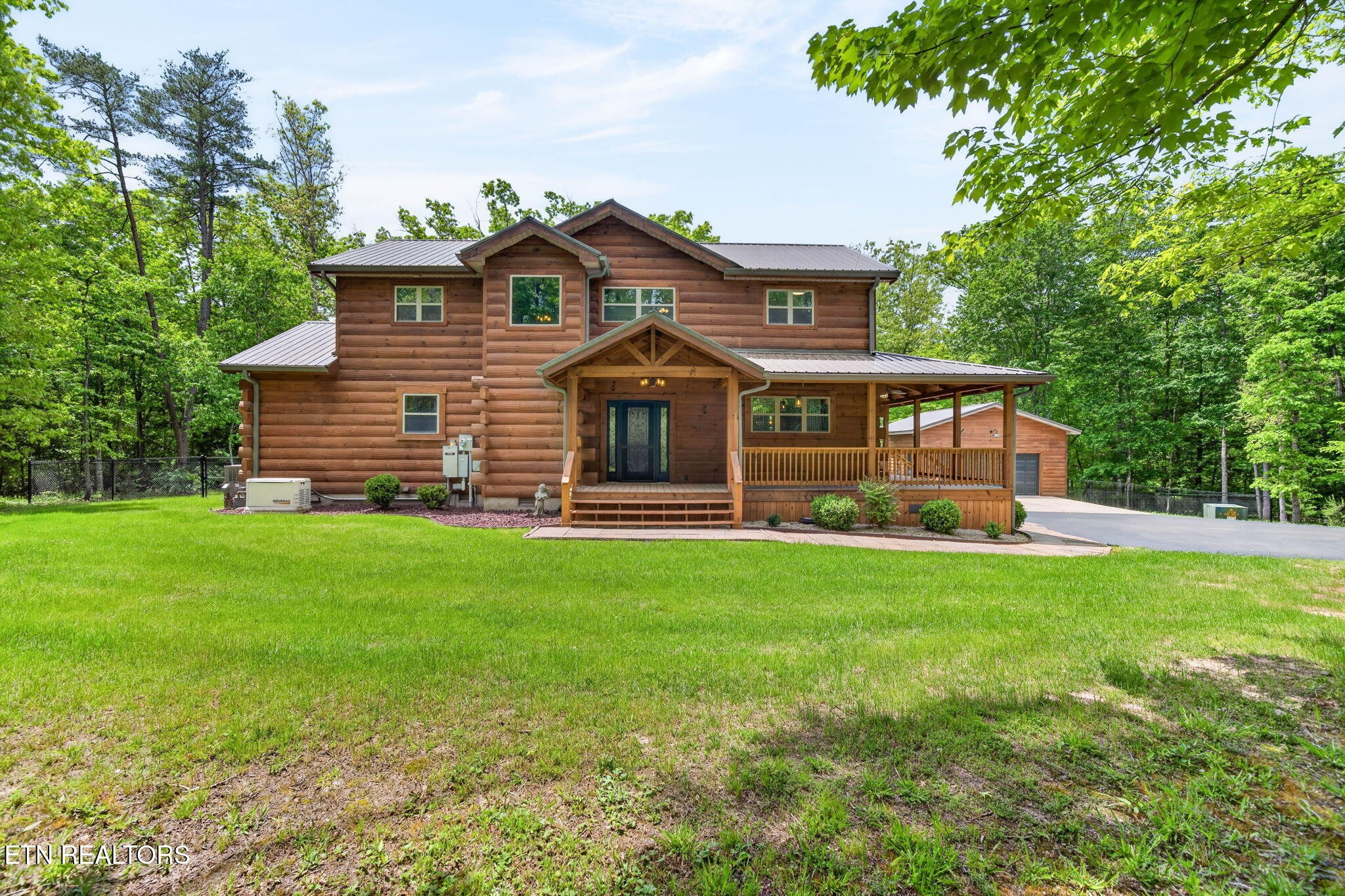 704 White Oak Road Monterey, TN 38574 - Photo 7 of 60 a front view of a house with a garden