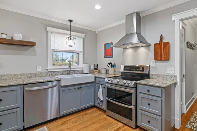 a kitchen with a stove and a sink