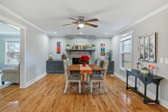a view of a dining room with furniture wooden floor and a chandelier