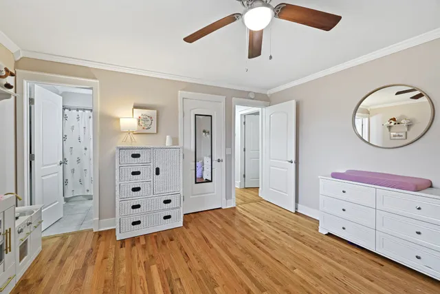 a room with dresser and window