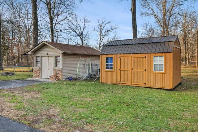 a front view of a house with yard