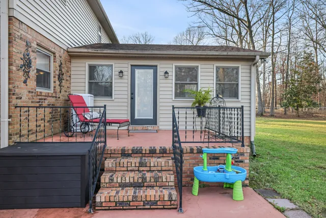 a view of a two chairs in the patio