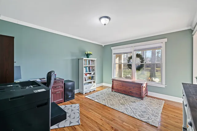 a living room with furniture rug and window
