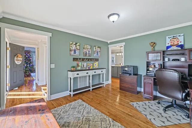 a work room with furniture and wooden floor