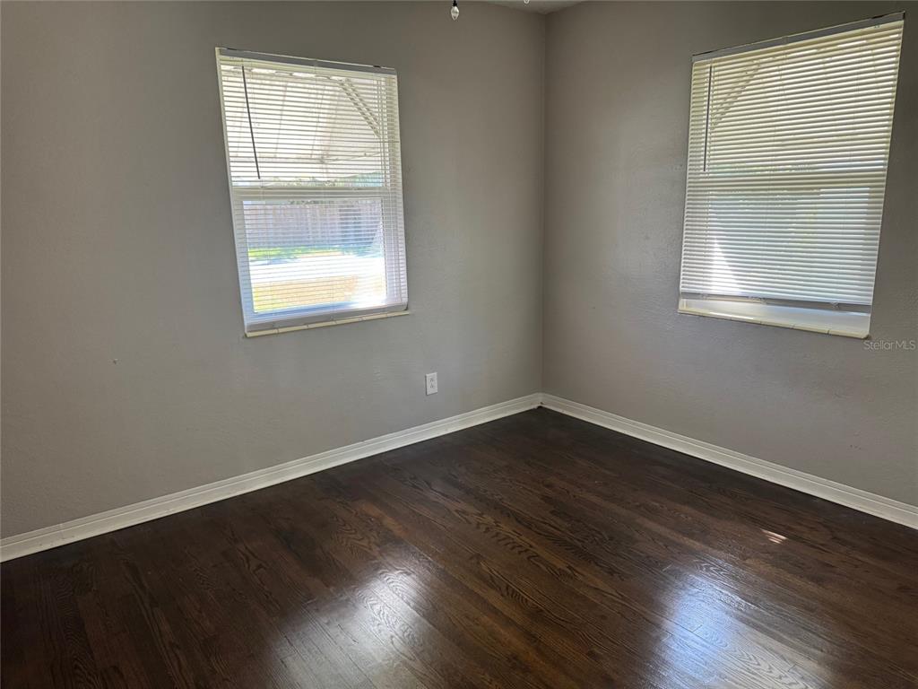 2500 14th Avenue North St. Petersburg, FL 33713 - Photo 11 of 27 an empty room with wooden floor and windows