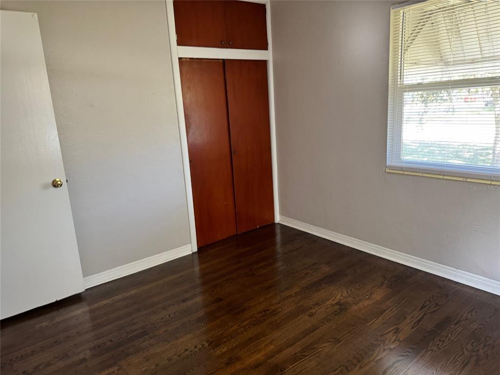 2500 14th Avenue North St. Petersburg, FL 33713 - Photo 12 of 27 an empty room with wooden floor and windows