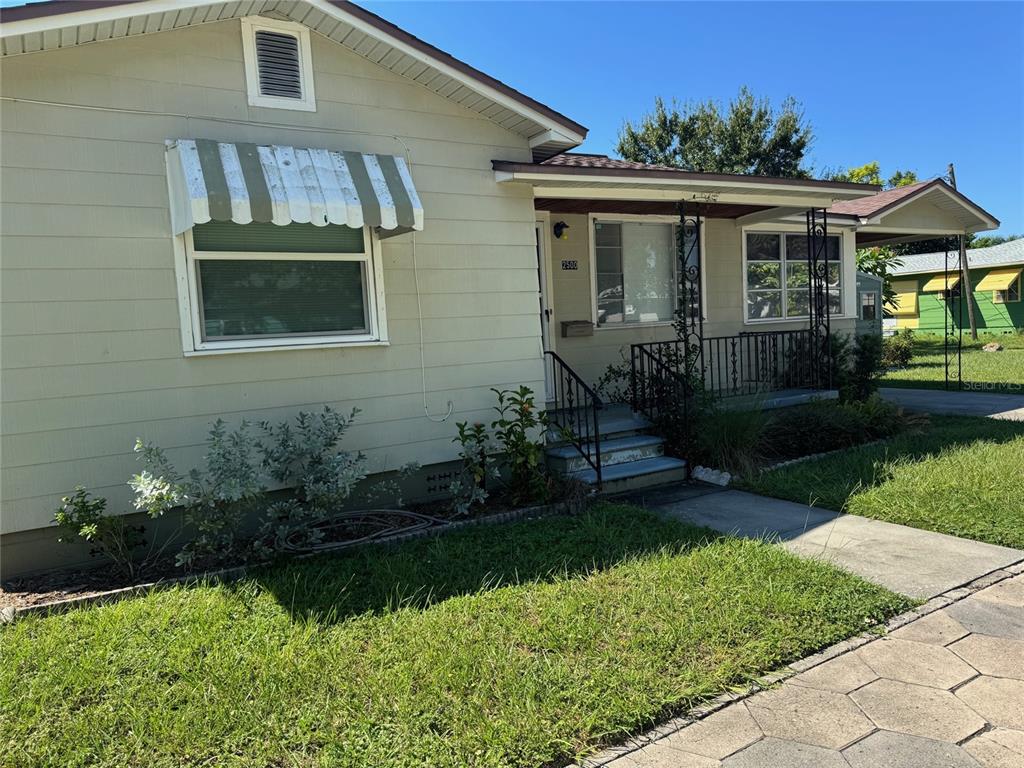 2500 14th Avenue North St. Petersburg, FL 33713 - Photo 3 of 27 a front view of a house with a yard