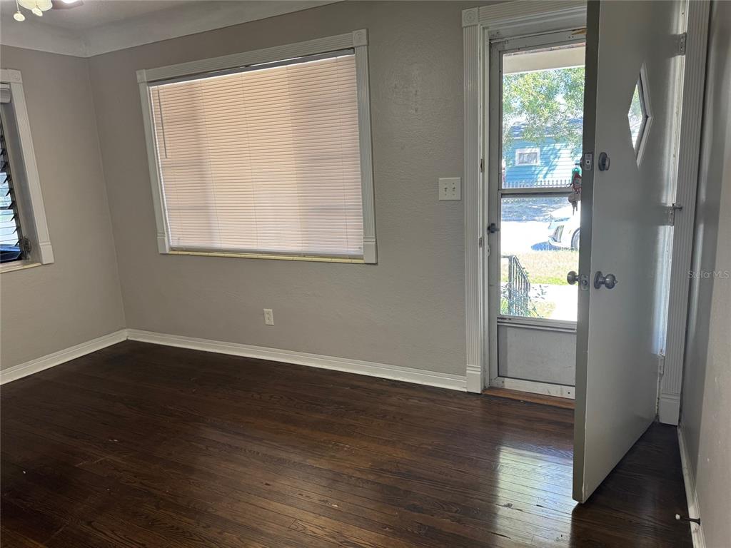 2500 14th Avenue North St. Petersburg, FL 33713 - Photo 7 of 27 a view of an empty room with wooden floor and a window