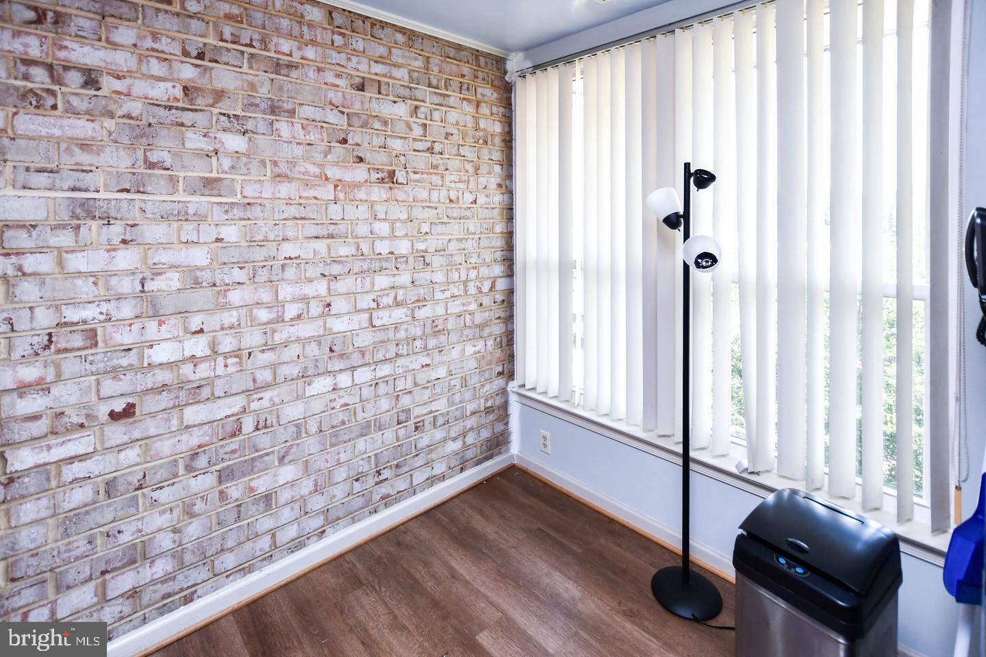 3319 Huntley Square Drive, Unit A Temple Hills, MD 20748 - Photo 11 of 17 a view of a room with wooden floor and windows