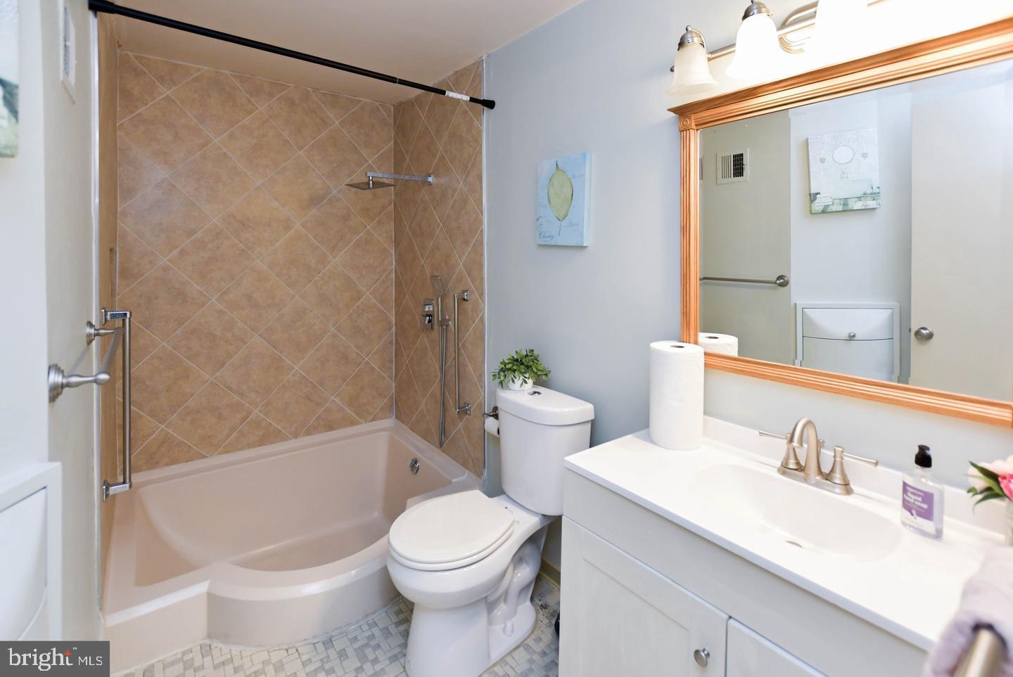 3319 Huntley Square Drive, Unit A Temple Hills, MD 20748 - Photo 13 of 17 a bathroom with a sink toilet and shower