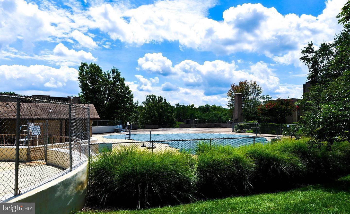 3319 Huntley Square Drive, Unit A Temple Hills, MD 20748 - Photo 17 of 17 a view of swimming pool with outdoor seating and plants