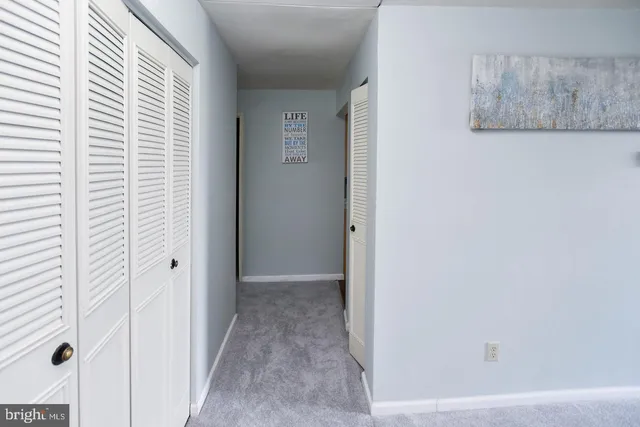 a view of a hallway with closet