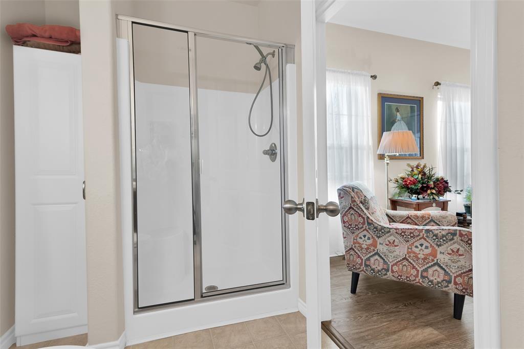201 East Walker Street Denison, TX 75021 - Photo 15 of 19 a bathroom with a shower