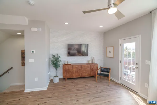 a living room with a couch and a flat screen tv