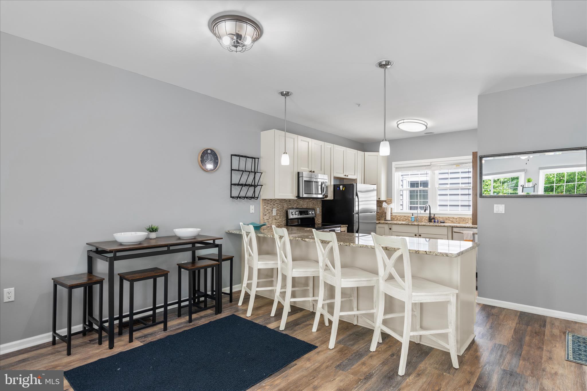 9739 Golf Course Road, Unit D102 Ocean City, MD 21842 - Photo 22 of 78 a view of a dining room with furniture window and wooden floor