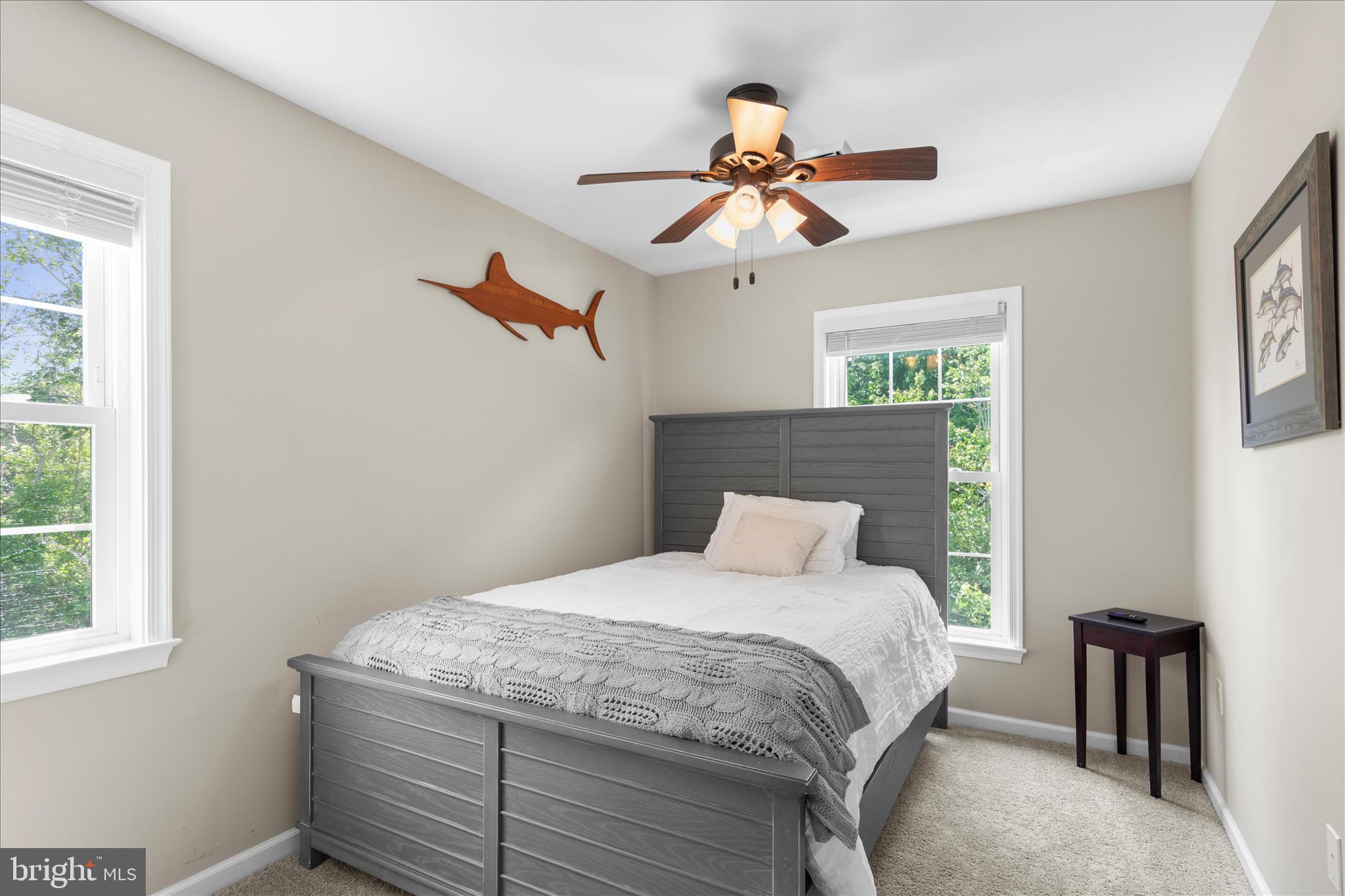 9739 Golf Course Road, Unit D102 Ocean City, MD 21842 - Photo 36 of 78 a bedroom with a bed and a chandelier