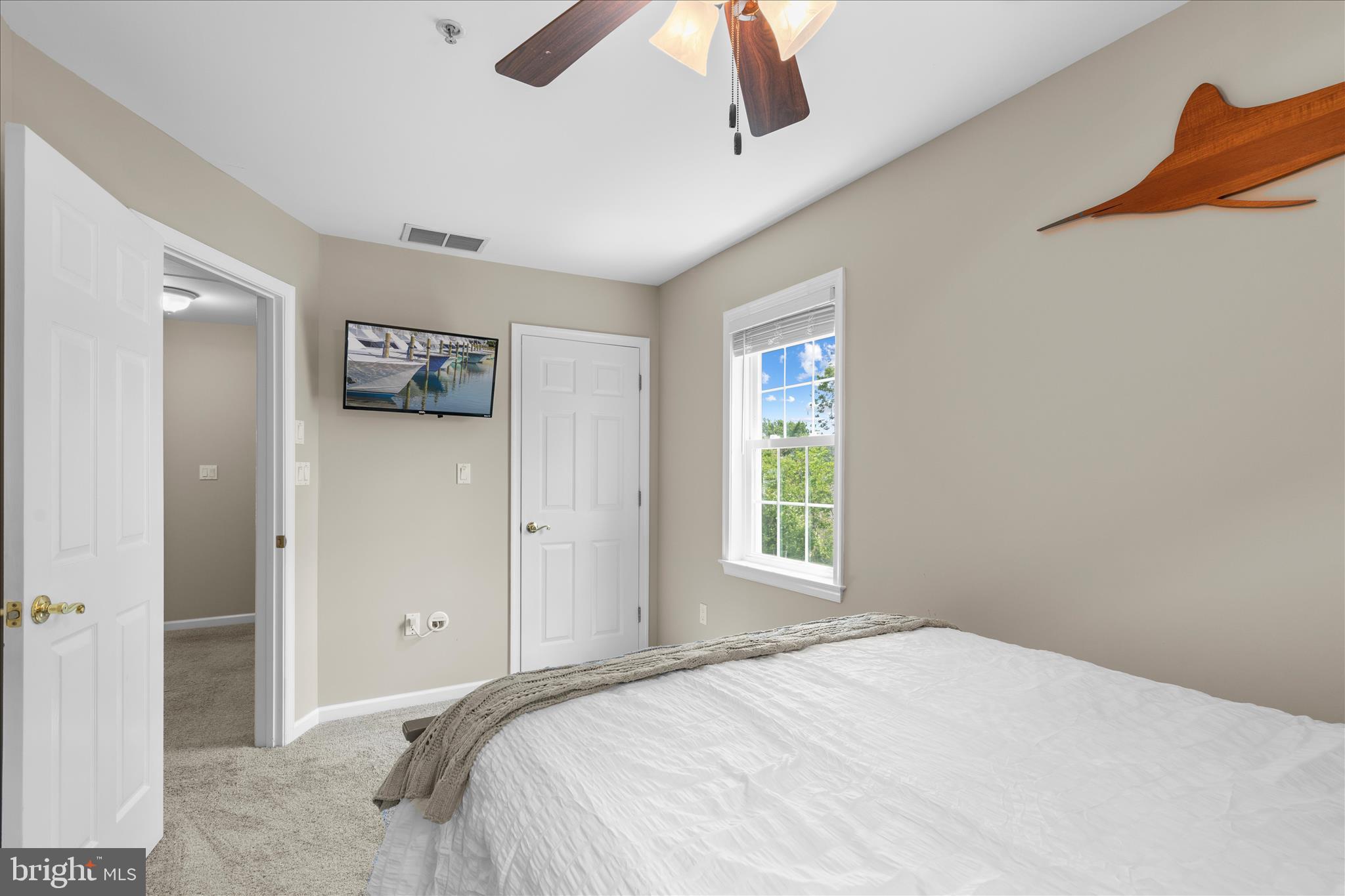 9739 Golf Course Road, Unit D102 Ocean City, MD 21842 - Photo 38 of 78 a bed room with a bed and a window