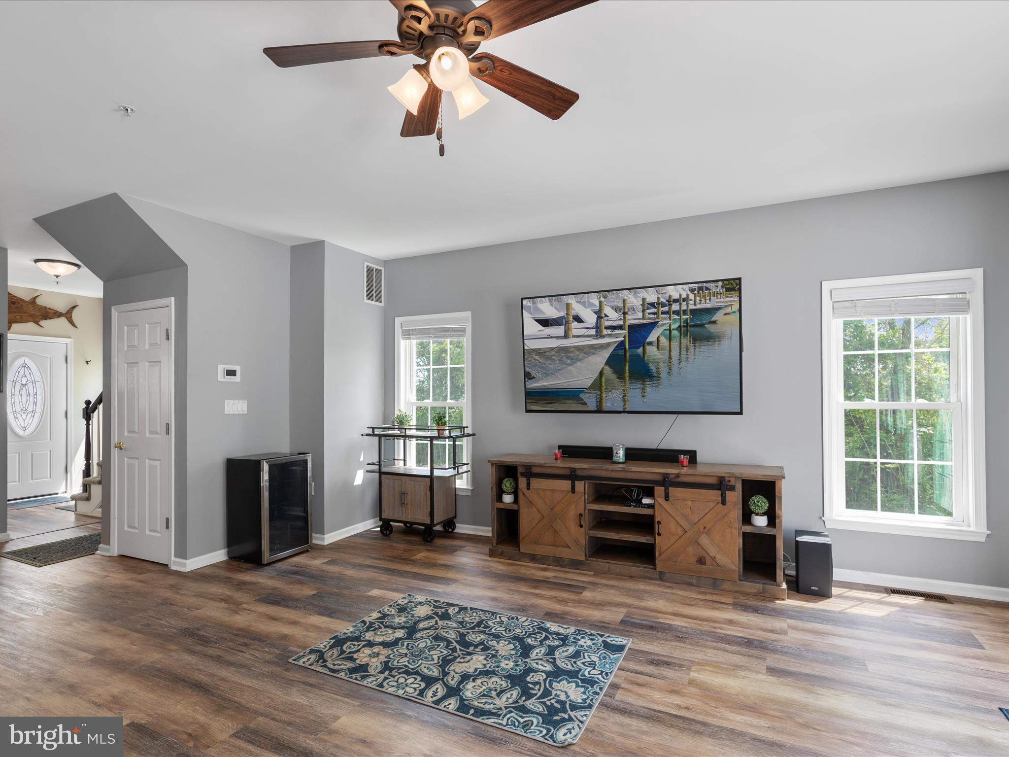 9739 Golf Course Road, Unit D102 Ocean City, MD 21842 - Photo 41 of 78 a living room with furniture and a flat screen tv