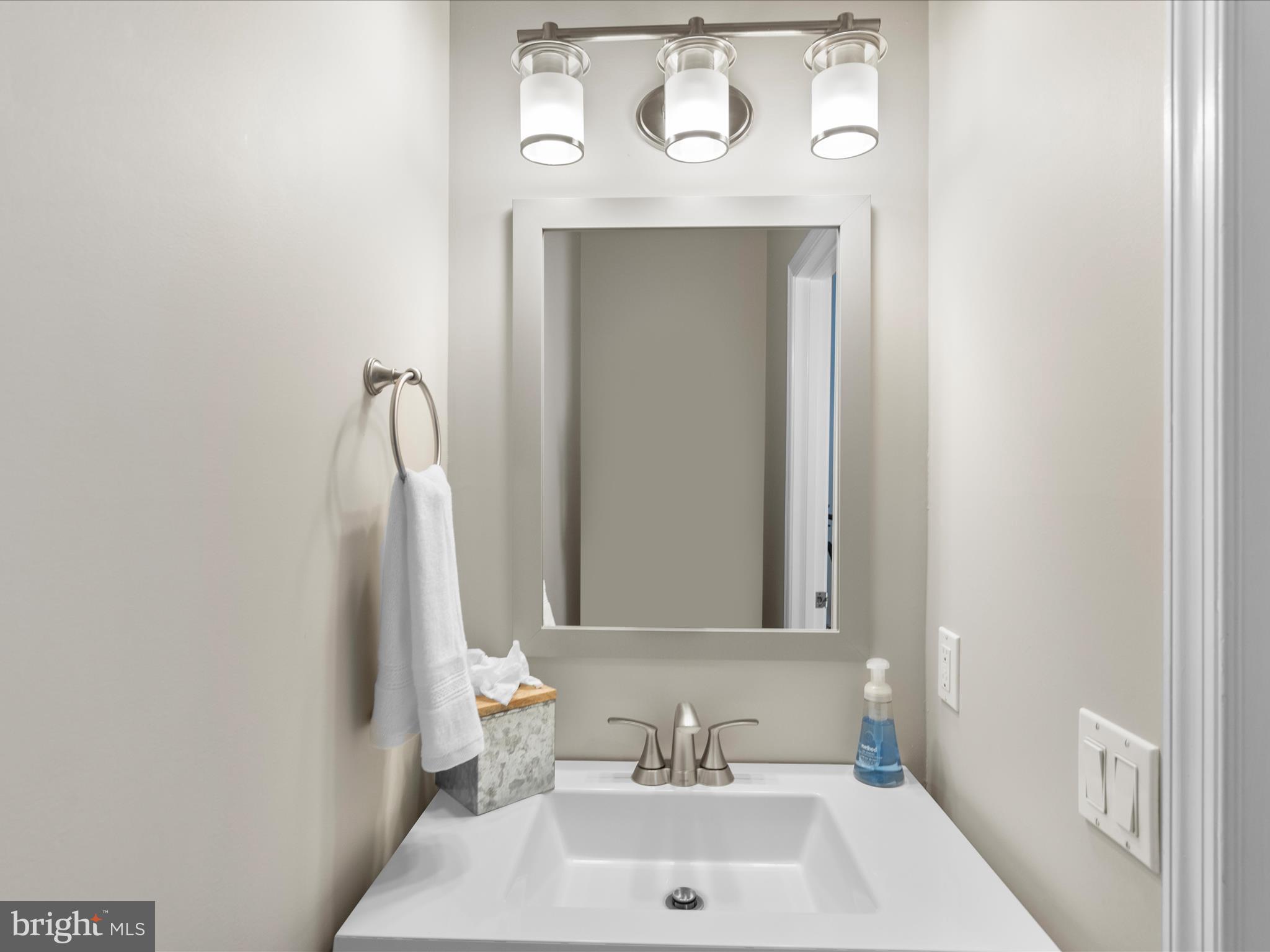 9739 Golf Course Road, Unit D102 Ocean City, MD 21842 - Photo 43 of 78 a bathroom with a sink and a mirror