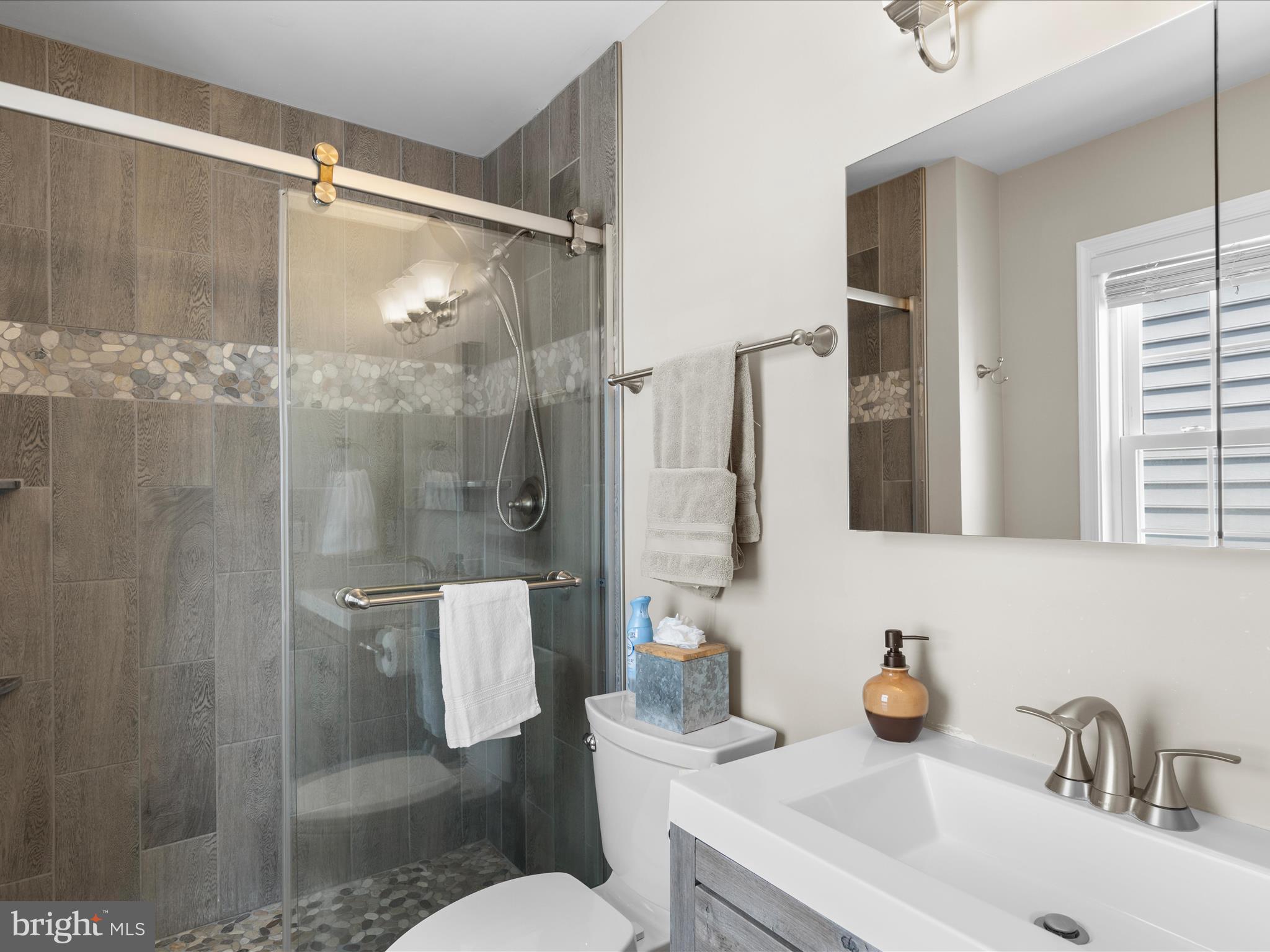 9739 Golf Course Road, Unit D102 Ocean City, MD 21842 - Photo 47 of 78 a bathroom with a sink toilet and shower