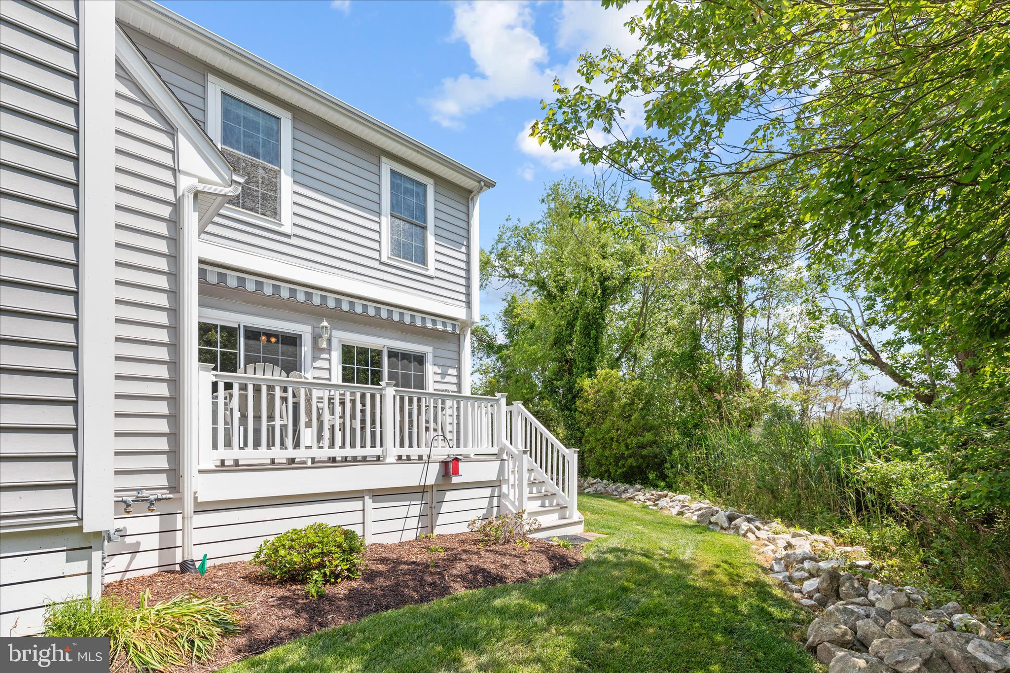 9739 Golf Course Road, Unit D102 Ocean City, MD 21842 - Photo 50 of 78 a front view of a house with a yard