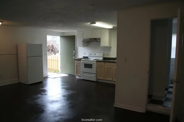 a kitchen with stainless steel appliances a stove and a refrigerator