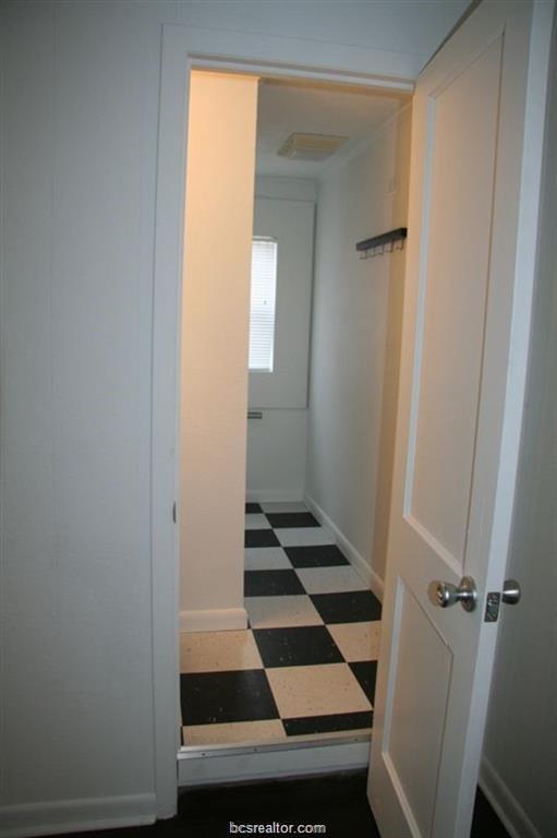 3109 Maloney Avenue, Unit A Bryan, TX 77801 - Photo 10 of 13 a picture of a bathroom with a sink and a mirror