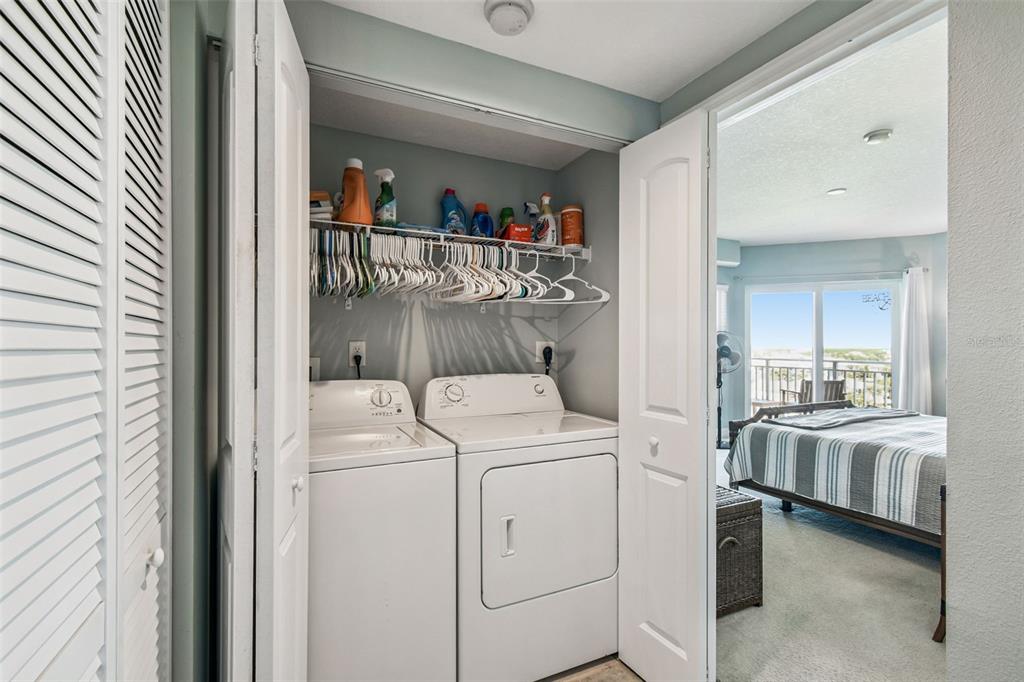 4516 Seagull Drive, Unit 807 New Port Richey, FL 34652 - Photo 19 of 100 a view of washer and dryer with bathroom in the background