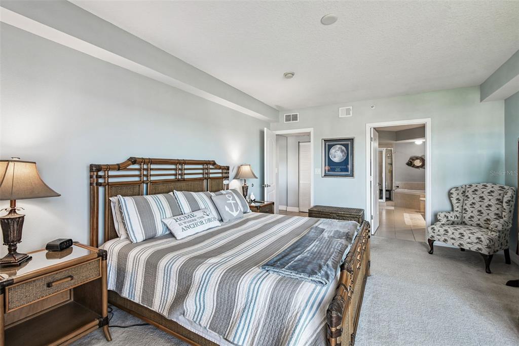 4516 Seagull Drive, Unit 807 New Port Richey, FL 34652 - Photo 22 of 100 a bedroom with a bed and a lamp on dresser